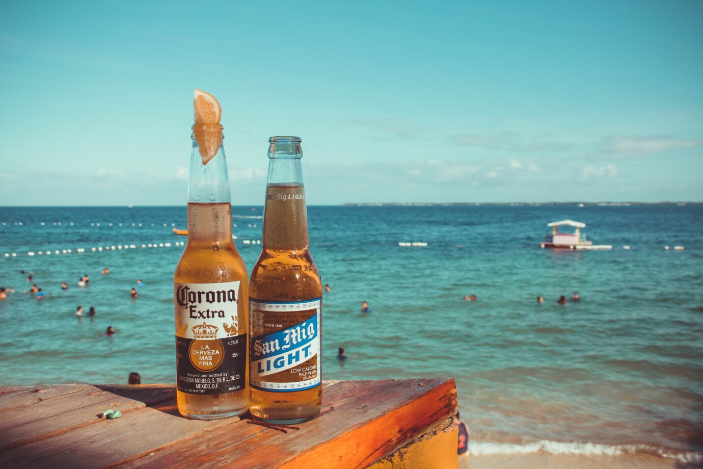 two-corona-extra-and-san-mig-light-beers-on-top-of-brown-767239-02607d01aa8f83d481777251b89d5b82_cd34fd